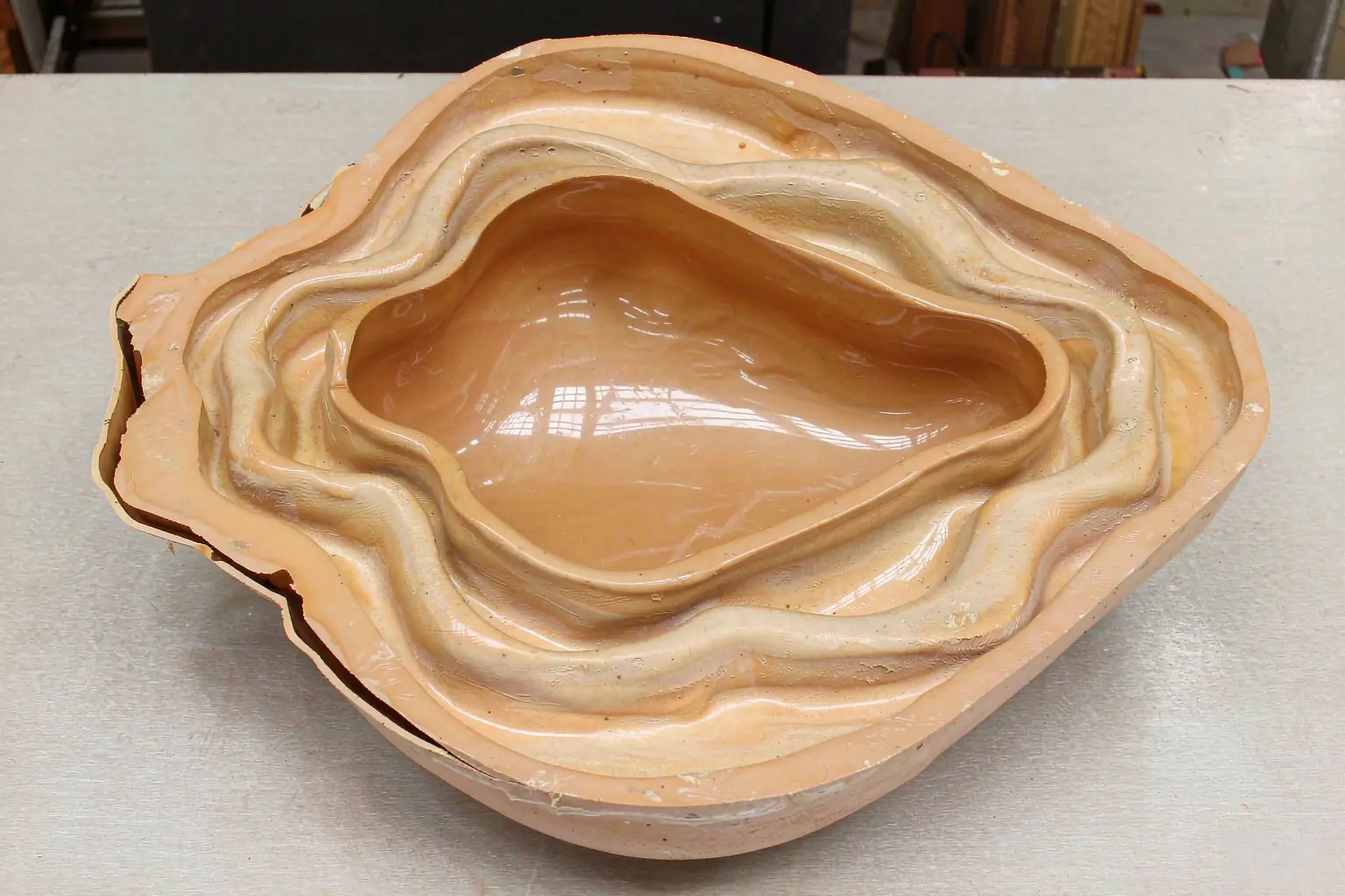 shell mold casting process - close view of a thin-walled resin sand shell mold half with smooth cavity surface