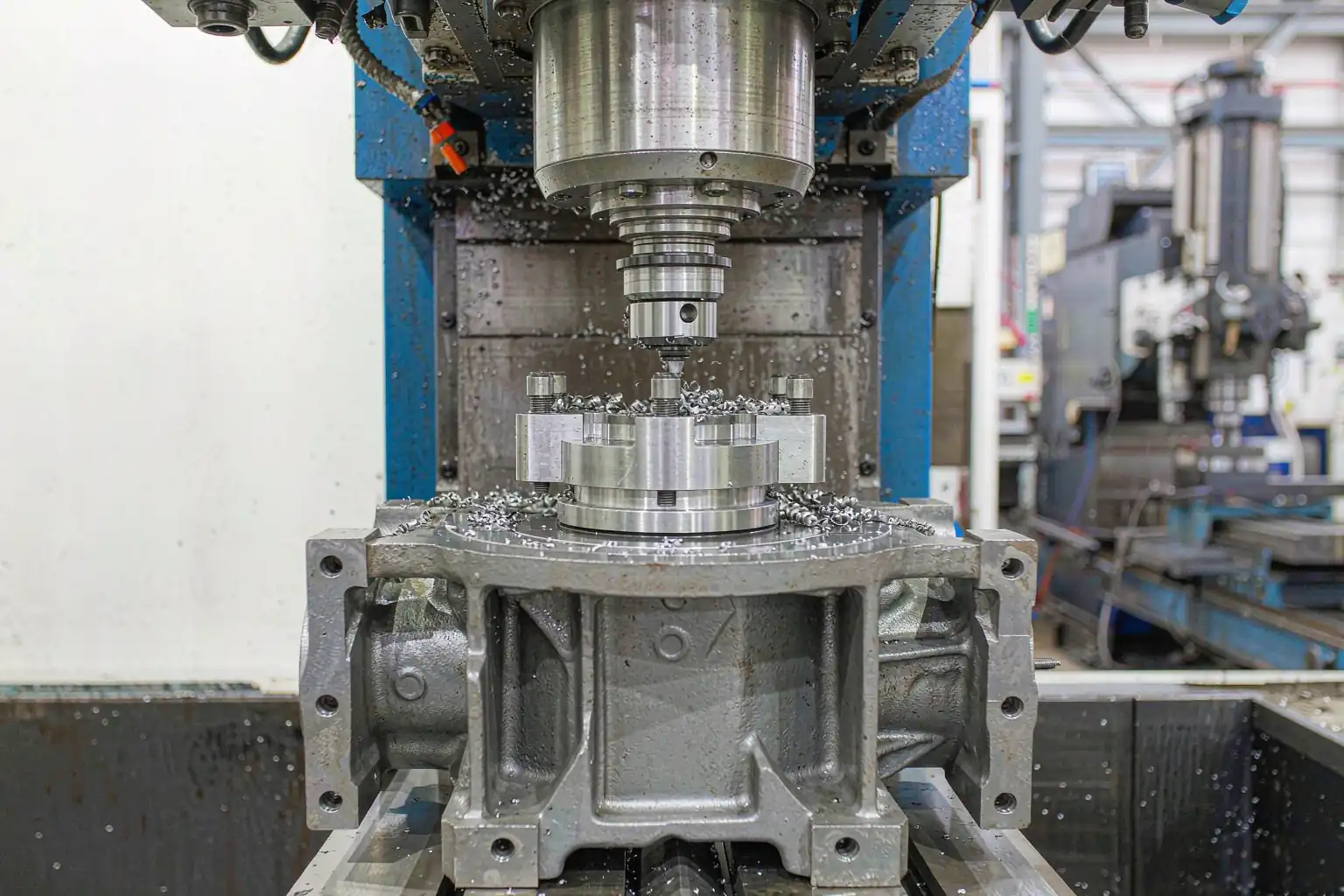 casting secondary operations — CNC machining a cast iron pump housing on a machining center