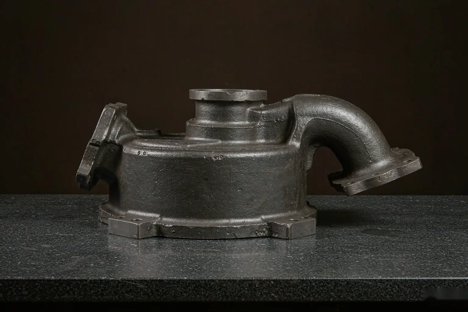casting tolerance stack — ductile iron pump housing with machined datum pads and measuring setup